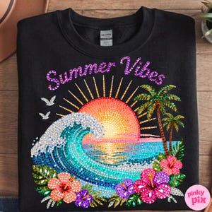 May include: Black sweatshirt with a colorful graphic design. The design features a mosaic-style sunset, ocean waves, palm trees, and hibiscus flowers. The words "Summer Vibes" are written across the top.