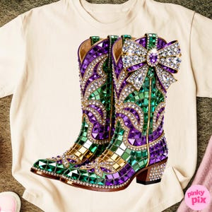 May include: A pair of decorative cowboy boots with a mosaic design in green, purple, and gold. The boots are embellished with rhinestones and a large bow on the top. The heels are also decorated with rhinestones.