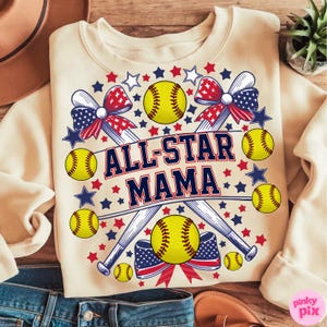 May include: Cream-colored sweatshirt with a softball-themed design. Features the text "ALL-STAR MAMA" in navy blue and red, surrounded by softballs, baseball bats, bows, and stars in red, white, and blue.