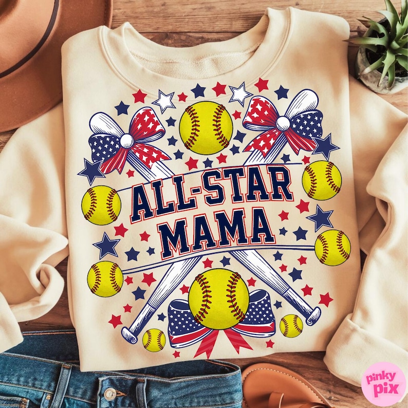 May include: Cream-colored sweatshirt with a softball-themed design. Features the text "ALL-STAR MAMA" in navy blue and red, surrounded by softballs, baseball bats, bows, and stars in red, white, and blue.