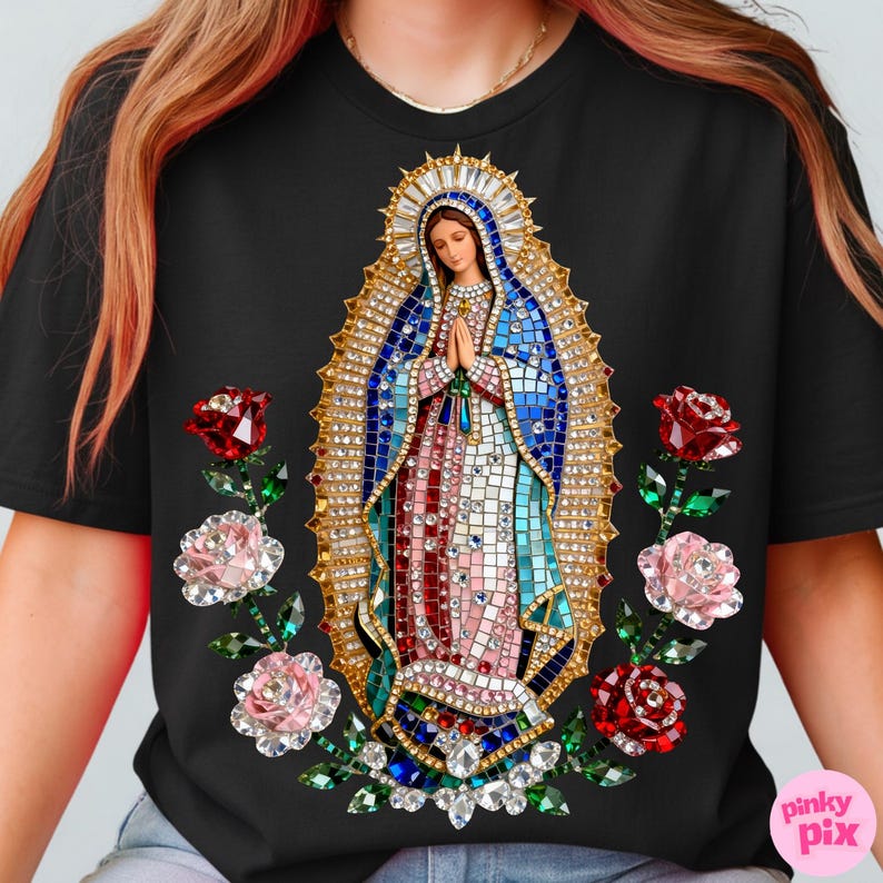 May include: Black t-shirt featuring a detailed mosaic-style image of a religious figure with hands clasped in prayer. The design includes a gold halo, blue and red robes, and is surrounded by red and pink roses with green leaves.