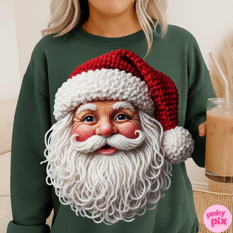 May include: A dark green sweatshirt featuring a detailed Santa Claus face with a red and white knitted hat and long white beard. The Santa face is the focal point, with blue eyes and a rosy complexion. The sweatshirt is a solid color.