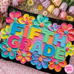 May include: A colorful pillow with the words "FIFTH GRADE" in bold, multi-colored letters, surrounded by vibrant, layered flower designs in shades of pink, yellow, blue, and green. The pillow is on a black surface.