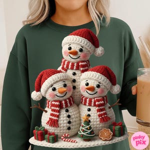 May include: A festive image featuring three crocheted snowmen wearing red and white Santa hats and scarves. Each snowman has a carrot nose and a smiling face. The snowmen are surrounded by Christmas decorations, including a small tree, gifts, and a gingerbread cookie.