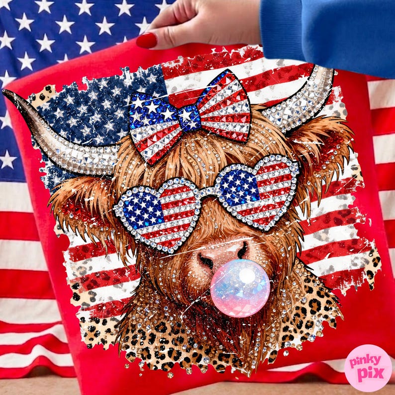 May include: A red pillow featuring a whimsical illustration of a Highland cow with patriotic embellishments. The cow wears heart-shaped sunglasses and a bow, both adorned with the American flag design. A bubblegum bubble adds a playful touch.