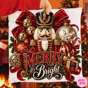 May include: A white decorative cushion featuring a central nutcracker illustration surrounded by gold jingle bells, a disco ball with the text 'Tis the Season', red ornaments, a leopard print gift box, and the red and gold text 'MERRY & Bright'.