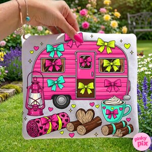 May include: A pink camper illustration with bows, a lantern, a rolled blanket, logs, and a mug of whipped cream. The camper has teal, pink, and yellow bows. The blanket and mug have heart designs. The background is a garden.