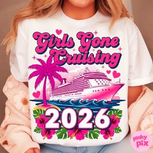 May include: White t-shirt with a pink graphic that says "Girls Gone Cruising 2026". The design includes a cruise ship, palm tree, hearts, and tropical flowers. The text and graphics are in shades of pink and white.