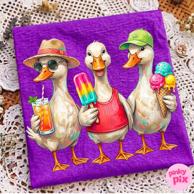 May include: A purple t-shirt featuring three cartoon ducks enjoying summer treats. One duck wears a straw hat and sunglasses, holding a cocktail. Another has a popsicle, and the third holds an ice cream cone. The shirt has the text "pinky pix" in the bottom right corner.
