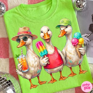 May include: Lime green t-shirt featuring three cartoon ducks enjoying summer treats. One duck wears a straw hat and sunglasses with a drink, another holds a popsicle, and the third has an ice cream cone. The ducks are in a colorful, whimsical style.