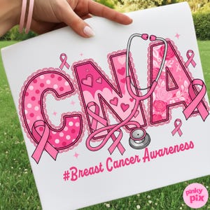 May include: A white sign with the letters "CNA" in pink, decorated with polka dots, hearts, and ribbons. A pink stethoscope is draped across the letters. The words "Breast Cancer Awareness" are below the letters.