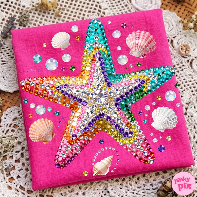 May include: A hot pink square with a large, bejeweled starfish in the center. The starfish is covered in colorful rhinestones. Scattered around the starfish are seashells and iridescent beads. The image has a beach or ocean theme.