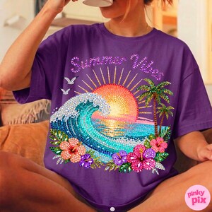 May include: Purple t-shirt with a vibrant beach scene design. The graphic includes a mosaic-style wave, sun, palm trees, and hibiscus flowers. The text "Summer Vibes" is arched above the sun.