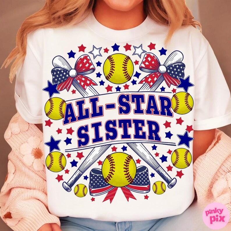 May include: White t-shirt with a softball-themed design. The design includes yellow softballs, crossed baseball bats, red, white, and blue bows, and the text "ALL-STAR SISTER" in blue and white.
