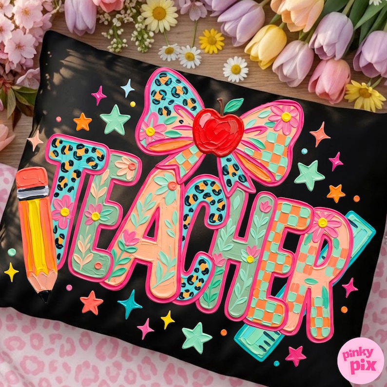 May include: Black pillow with the word "TEACHER" in colorful, 3D lettering. The design includes a pencil, stars, and a bow with an apple. The letters have floral and leopard print accents.
