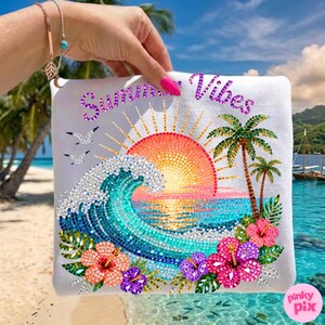 May include: White square pillow with a colorful beach scene. The design features a mosaic-style sunset, ocean waves, palm trees, and hibiscus flowers. The words "Summer Vibes" are written across the top in purple.