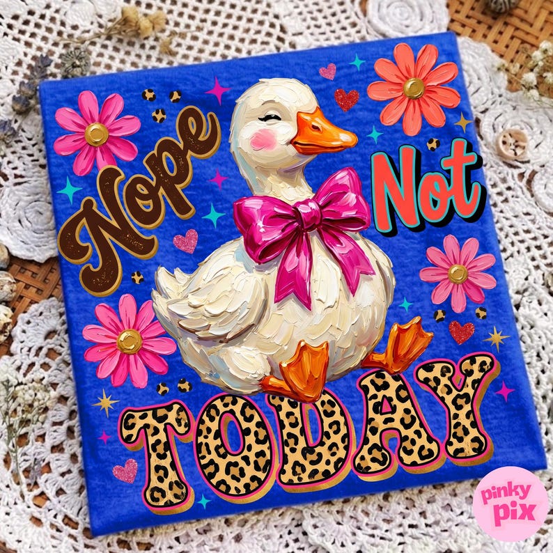 May include: A blue t-shirt featuring a whimsical duck with a pink bow, surrounded by flowers and hearts. The words "Nope Not TODAY" are displayed in a playful font with leopard print accents. The design has a retro, illustrative style.