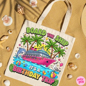 May include: Cream tote bag featuring a vibrant illustration of a cruise ship, palm trees, and a dolphin. The text on the bag says "BOARD THE SHIP IT'S A BIRTHDAY TRIP". The bag has cream handles and is on a sandy surface with seashells.