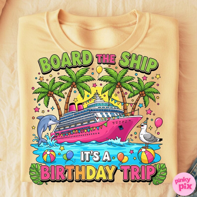 May include: A pale yellow sweatshirt with a vibrant graphic. The design includes a pink cruise ship, palm trees, a dolphin, and the text "BOARD THE SHIP" and "IT'S A BIRTHDAY TRIP".