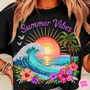 May include: Black t-shirt with a colorful graphic of a sunset over the ocean, palm trees, and hibiscus flowers. The words "Summer Vibes" are written across the top in a purple, glittery font. Two birds are flying above the wave.