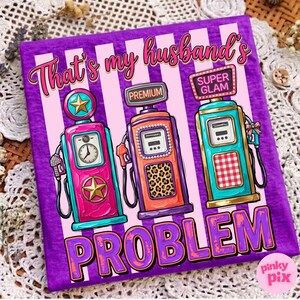 May include: A purple canvas print with the text "That's my husband's PROBLEM." The print features three colorful gas pumps with the words "Premium" and "Super Glam". The gas pumps are pink, orange, and teal.