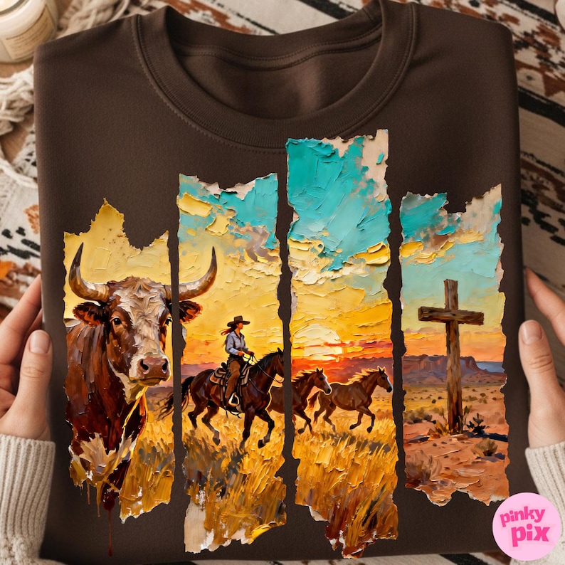 May include: Brown sweatshirt featuring a Western-themed graphic. The design includes a bull, a cowgirl on horseback, and running horses against a sunset backdrop. A wooden cross is also visible. The graphic has a textured, painted appearance.