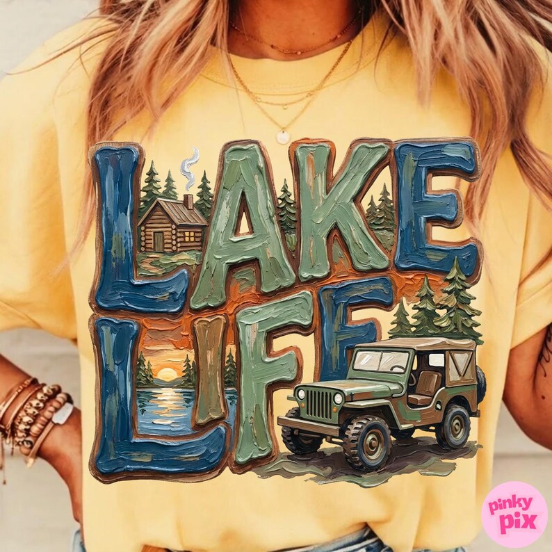 May include: Yellow t-shirt with a graphic that says "LAKE LIFE" in blue and green block letters. The graphic includes a cabin, trees, a lake scene, and a green jeep.