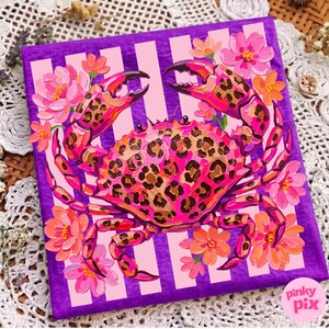 May include: A vibrant painting of a crab with a leopard print design on a purple background with pink stripes. The crab is surrounded by pink and orange flowers. The artwork is signed "pinky pix".