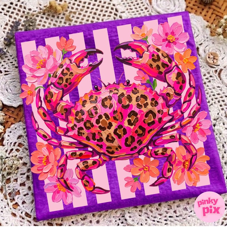 May include: A vibrant painting of a crab with a leopard print design on a purple background with pink stripes. The crab is surrounded by pink and orange flowers. The artwork is signed "pinky pix".