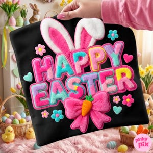 May include: Black pillow with a colorful "Happy Easter" design. The design includes bunny ears, a bow with a carrot, flowers, and hearts. The text is in pink, blue, yellow, and purple.