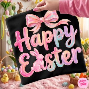 May include: Black pillowcase with a pastel-colored bow and the words "Happy Easter" in a colorful, brushstroke font. A pink bunny is featured in the design. The pillowcase is held up by a person.