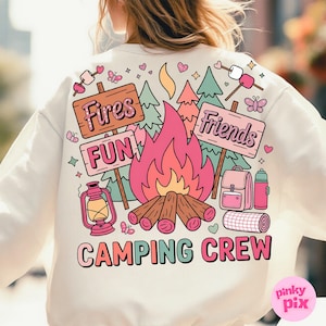 May include: White sweatshirt with a colorful camping-themed graphic. The design includes a campfire, signs that say "Fires Fun" and "Friends", trees, a lantern, and the words "Camping Crew". Butterflies and hearts are also included.