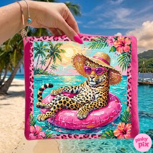 May include: A pink square beach towel with a leopard wearing sunglasses and a straw hat, relaxing on a pink inflatable ring in the ocean. The towel has a tropical scene with palm trees, flowers, and a pink border.