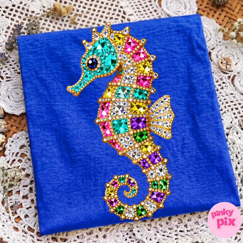 May include: A colorful seahorse design with a gold outline and encrusted with various colored gems. The seahorse is set against a blue background. The seahorse's body is adorned with gems in shades of turquoise, pink, yellow, and purple.