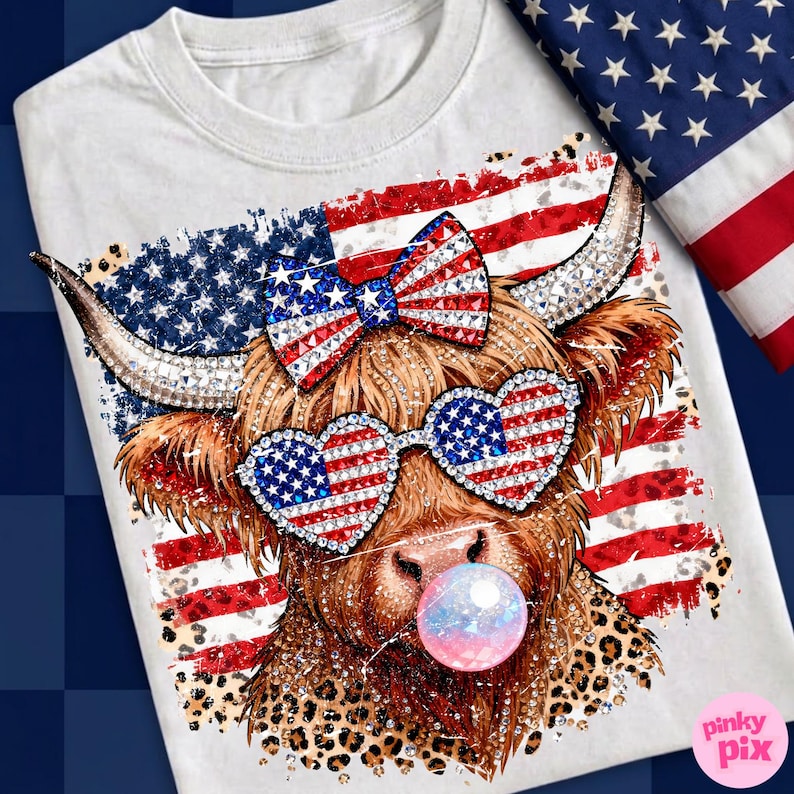 May include: White t-shirt featuring a Highland cow with patriotic sunglasses and a bow, both adorned with the American flag design. The cow is blowing a bubblegum bubble. The background includes the American flag.