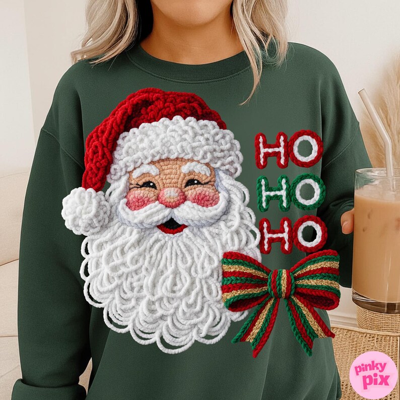 May include: Dark green sweatshirt featuring a crocheted Santa Claus design with a red hat, white beard, and the words "HO HO HO" in red and green. A red, green, and gold bow is also part of the design. The sweatshirt is a festive holiday item.