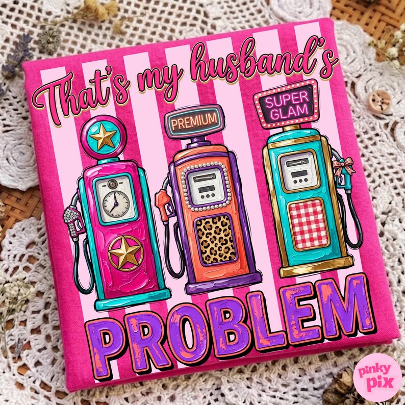 May include: A pink t-shirt with a design featuring three colorful vintage gas pumps. The pumps are in shades of pink, orange, and teal, with the text "That's my husband's PROBLEM" in a playful font. The background has pink and white stripes.