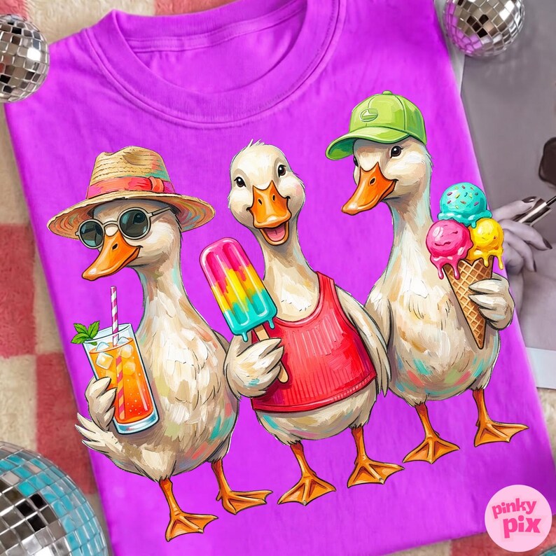 May include: A purple t-shirt featuring a whimsical illustration of three ducks. One duck wears sunglasses and a straw hat, holding a drink. Another holds a popsicle, and the third has an ice cream cone. The ducks are depicted in a cartoon style.