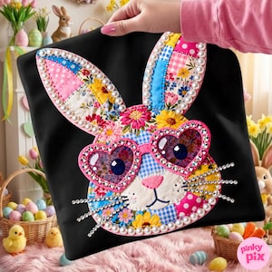 May include: Black tote bag featuring a colorful patchwork bunny face with heart-shaped sunglasses. The bunny's ears and face are adorned with floral patterns, pearls, and rhinestones. A whimsical Easter-themed design.