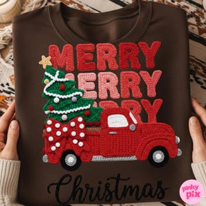May include: Brown sweatshirt with a crochet design featuring a red truck carrying a Christmas tree and a large bow. The words "MERRY CHRISTMAS" are displayed in red and pink crochet letters.