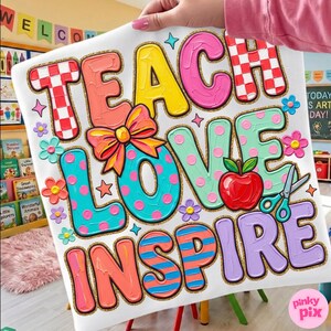 May include: White canvas with the words "TEACH LOVE INSPIRE" in colorful, textured lettering. The design includes a red apple, scissors, and floral accents. The letters have glittery gold outlines, and the overall theme is education and art.