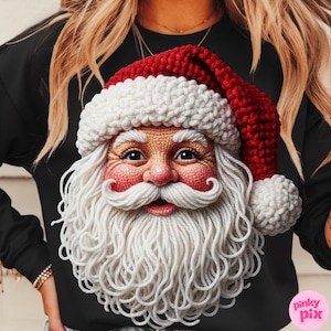 May include: Black sweatshirt featuring a detailed Santa Claus face. The Santa design includes a red and white knit hat, a long white beard, rosy cheeks, and blue eyes. The image is a close-up of the Santa Claus design.
