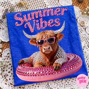 May include: Blue t-shirt with a graphic of a Highland cow wearing sunglasses and a bejeweled floatie. The text "Summer Vibes" is in pink glitter. The cow is adorned with rhinestones. The Pinky Pix logo is in the bottom right corner.