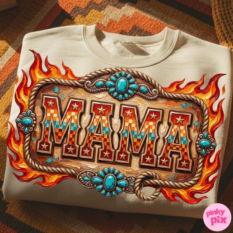May include: Cream-colored sweatshirt featuring a decorative design with the word "MAMA" in a western-style font. The design includes a wooden-look frame, turquoise-colored accents, stars, and flames. The sweatshirt is displayed on a patterned surface.
