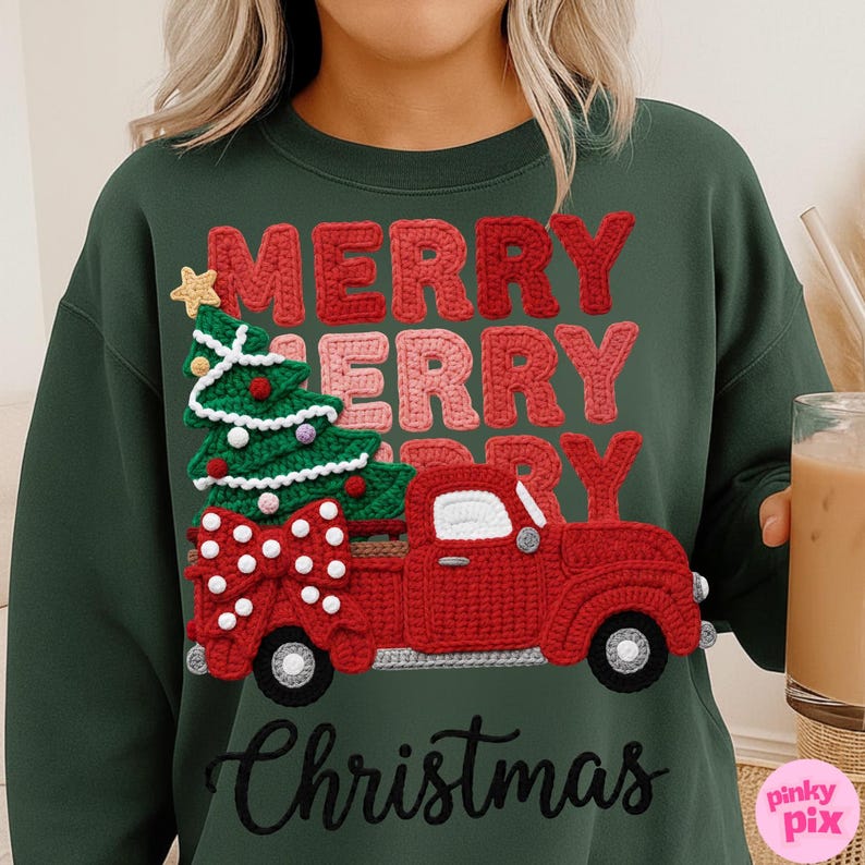 May include: Green sweatshirt with a crochet design featuring a red truck carrying a Christmas tree and a large bow. The words "MERRY MERRY CHRISTMAS" are in red and pink crochet letters.