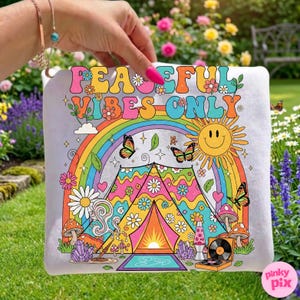 May include: A square, light gray pillow with a colorful, retro design. The design includes a rainbow, butterflies, a smiling sun, and the text "PEACEFUL VIBES ONLY". The pillow has a whimsical, bohemian theme.
