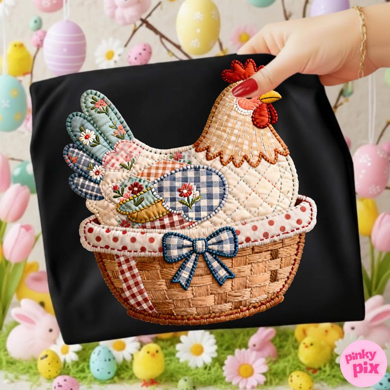 May include: Black t-shirt with a quilted hen design in a basket. The hen features patchwork with floral and gingham patterns. The basket has a woven texture and a blue gingham bow. Easter-themed.