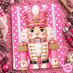 May include: A nutcracker figure with a pink and white polka dot background. The nutcracker wears a pink uniform with gold trim, a tall pink hat with a white feather, and a white beard. The design features heart accents on the hat and sleeves.