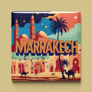 May include: A square magnet featuring a colorful illustration of Marrakech. The design includes a mosque with minarets, palm trees, camels, and the city's name in large, stylized letters. The background depicts a night sky.