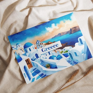 May include: Watercolor illustration of Greece featuring white buildings with blue domes and accents, set against a blue sea and sky. The word "Greece" is displayed on a white sign. The image is on a beige fabric background.